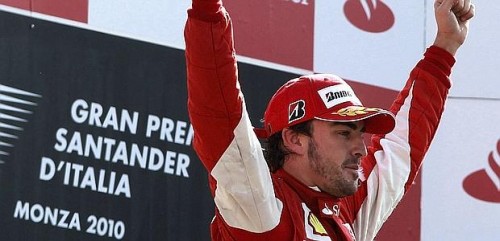 Ferrari Formula One driver Alonso of Spain celebrates on the podium after winning the Italian F1 Grand Prix at the Monza circuit