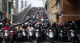 Motorists ride to work on a bridge during rush hour in Taipei, Taiwan