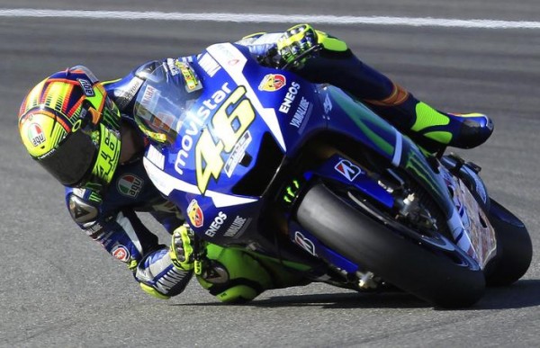 MotoGP rider Valentino Rossi of Italy steers his motorcycle during the Valencia Motorcycle Grand Prix, the last race of the season, at the Ricardo Tormo circuit in Cheste near Valencia, Spain, Sunday, Nov. 8, 2015. (ANSA/AP Photo/Alberto Saiz)